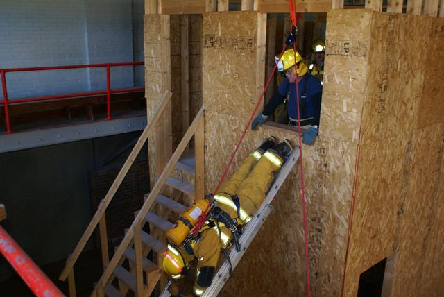 Craig Barry Eeits 2nd story window head first. Ladder bail technique during New York State Firefighter Survival course in Willsboro NY 9/25/2010